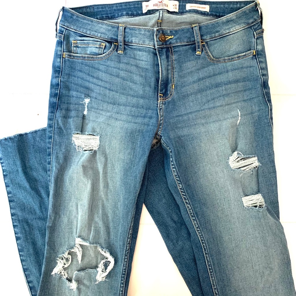 blue distressed low rise skinny jeans